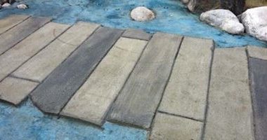 Randall Klassen, of Winnipeg, Manitoba, sent us these photos of a monolithically poured concrete "bridge" over concrete "water" he constructed for Seven Oaks School Division, in northwest Winnipeg.